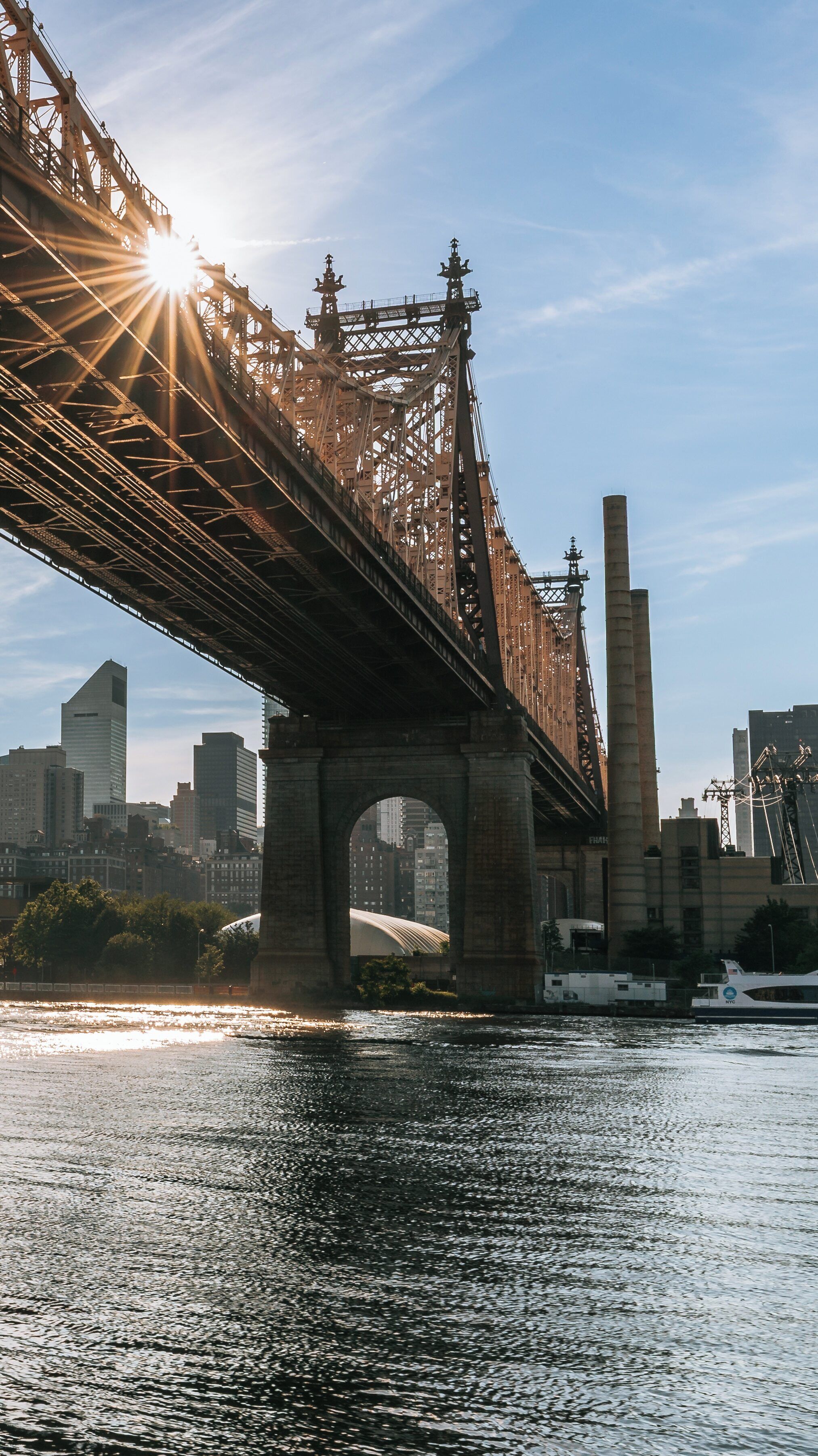 Stunning view of Queensbridge Park featuring the iconic Queensboro Bridge at sunset in Long Island City, New York showcasing urban beauty