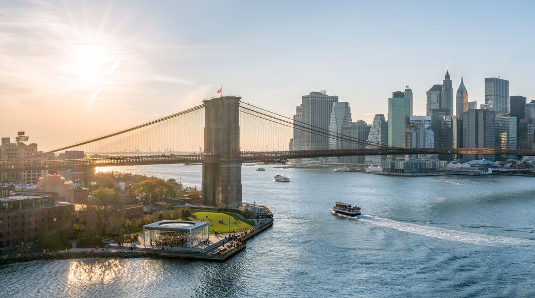 New York City skyline panorama at sunset with Brooklyn Bridge