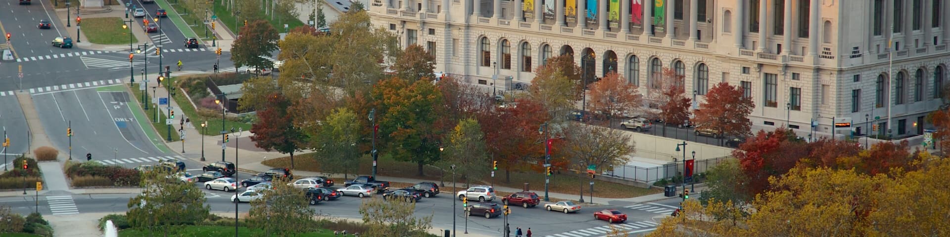Cityscape view of Philadelphia showcasing autumn foliage and municipal architecture near a fountain