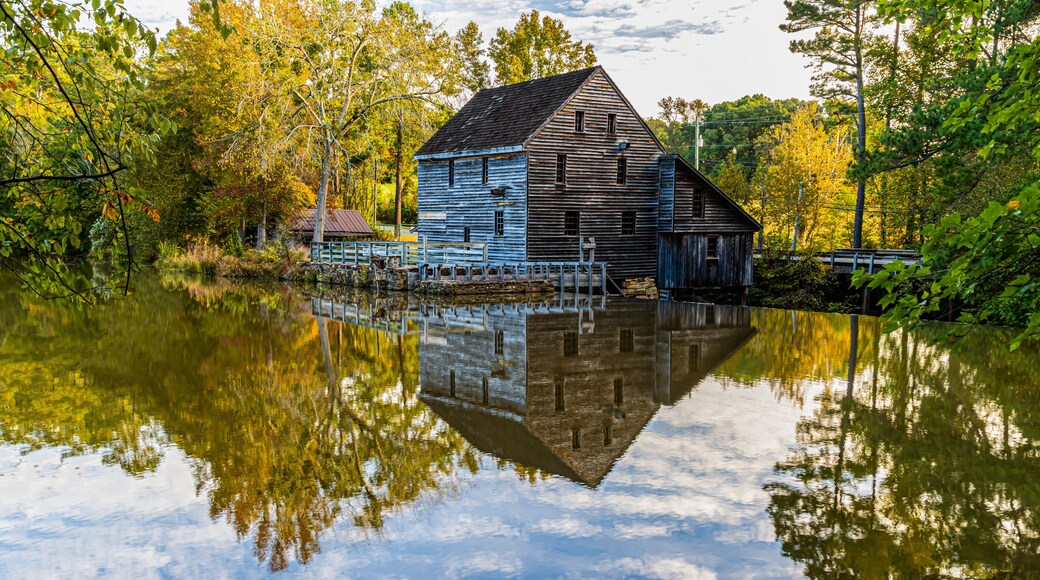 Historic Yates Grist Mill Reflecting in Yates Mill Pond, Raleigh, North Carolina, USA