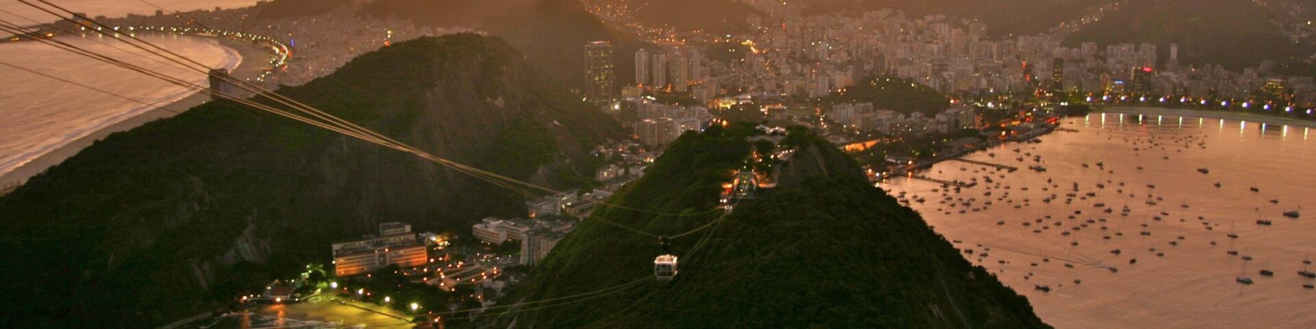 Rio de Janeiro which includes general coastal views, a sunset and mountains