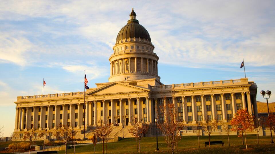 Salt Lake City skyline showcases the iconic Utah State Capitol during sunset and vibrant autumn foliage