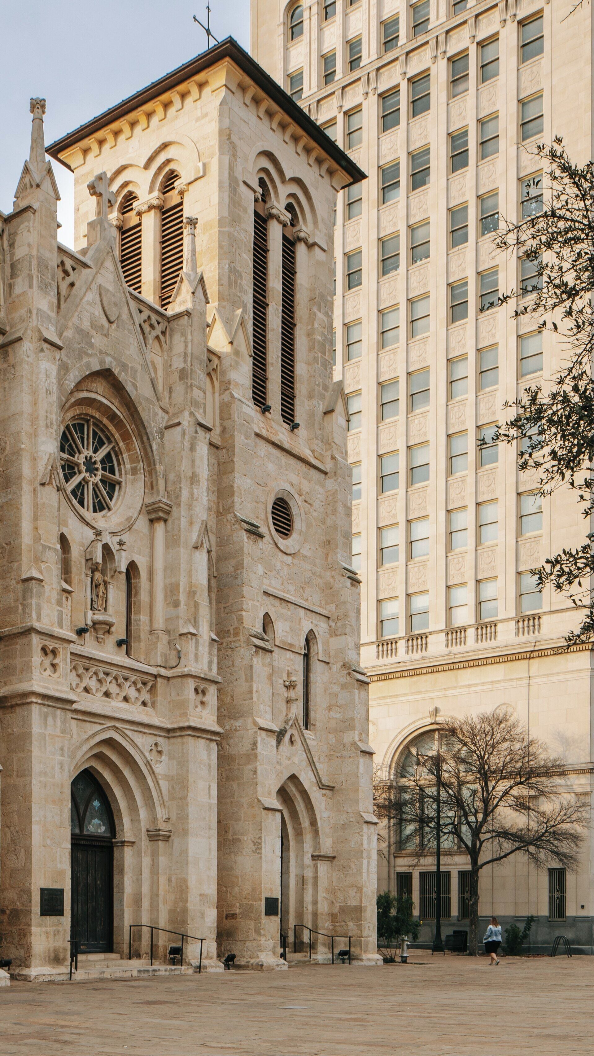 Cathedral of San Fernando stands majestically in downtown San Antonio, Texas, showcasing its historical architecture beside modern buildings