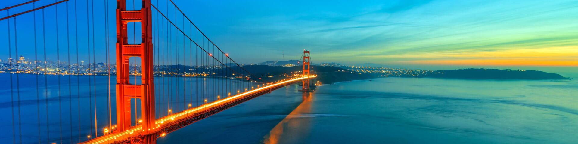 Golden Gate Bridge after sunset illuminated by lights. Sunset over San Francisco bay California USA
