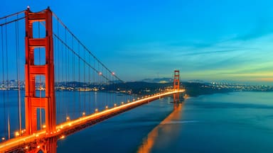 Golden Gate Bridge after sunset illuminated by lights. Sunset over San Francisco bay California USA