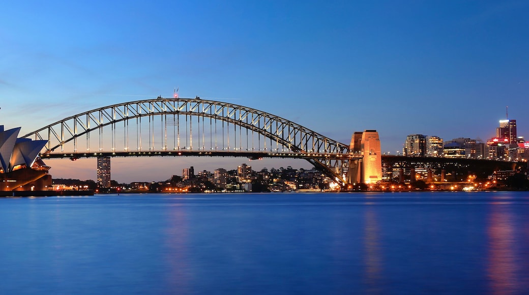 The Sydney Opera House and Sydney Harbour Bridge at dusk.