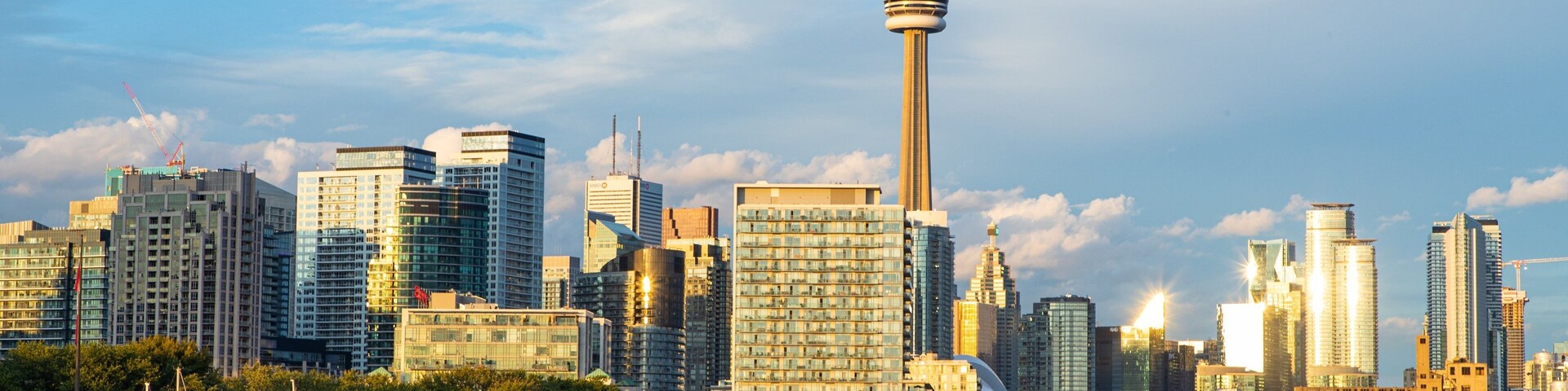 Toronto which includes a bay or harbor, a sunset and a city