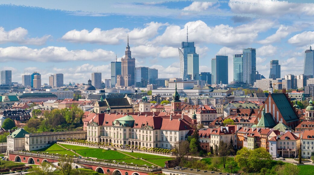 A cityscape with historic buildings and modern skyscrapers.