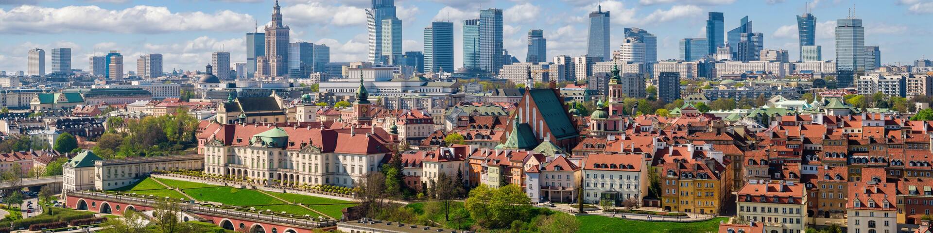 A cityscape with historic buildings and modern skyscrapers.