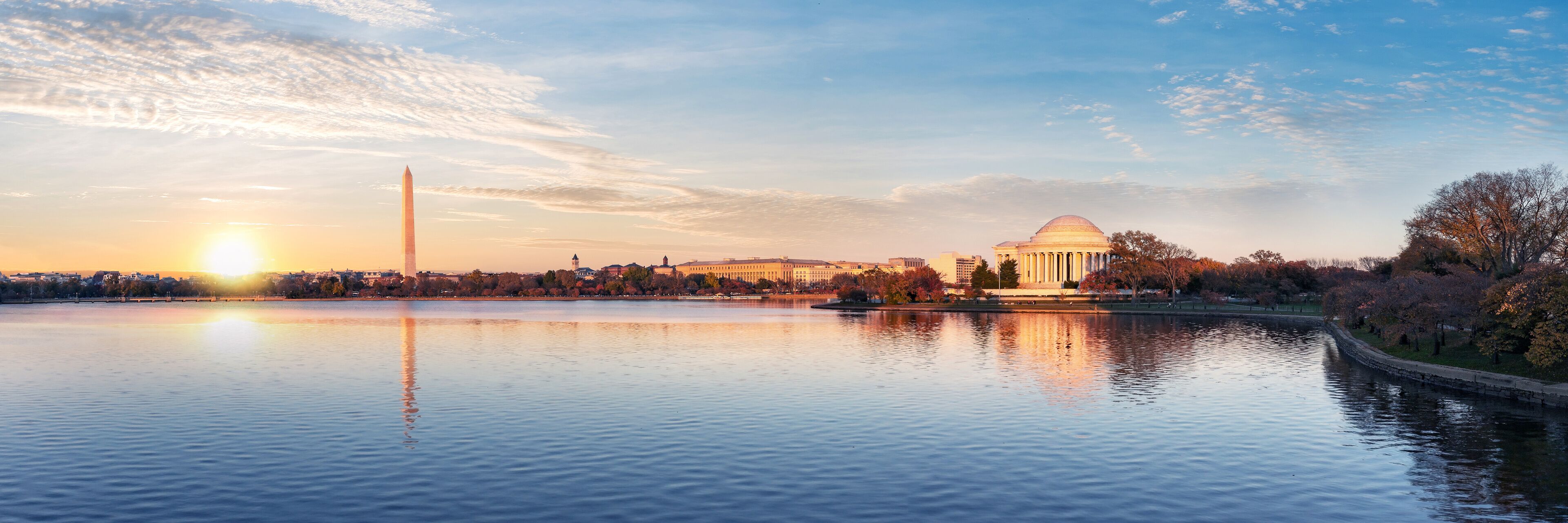 Jefferson Memorial and Washington Monument reflected on Tidal Basin in the morning, Washington DC, USA. Panoramic image