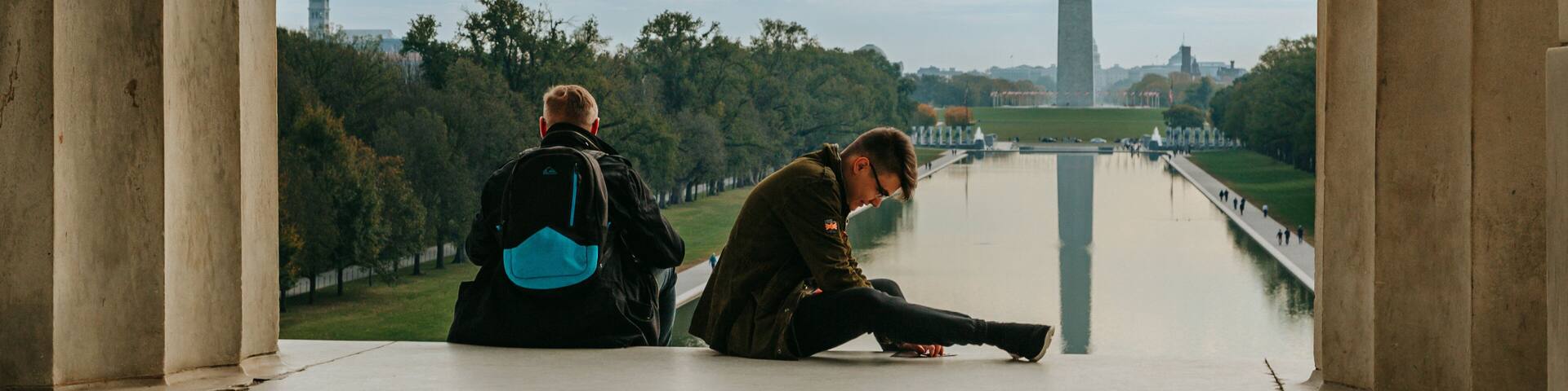 Washington featuring a monument and an administrative buidling as well as a couple