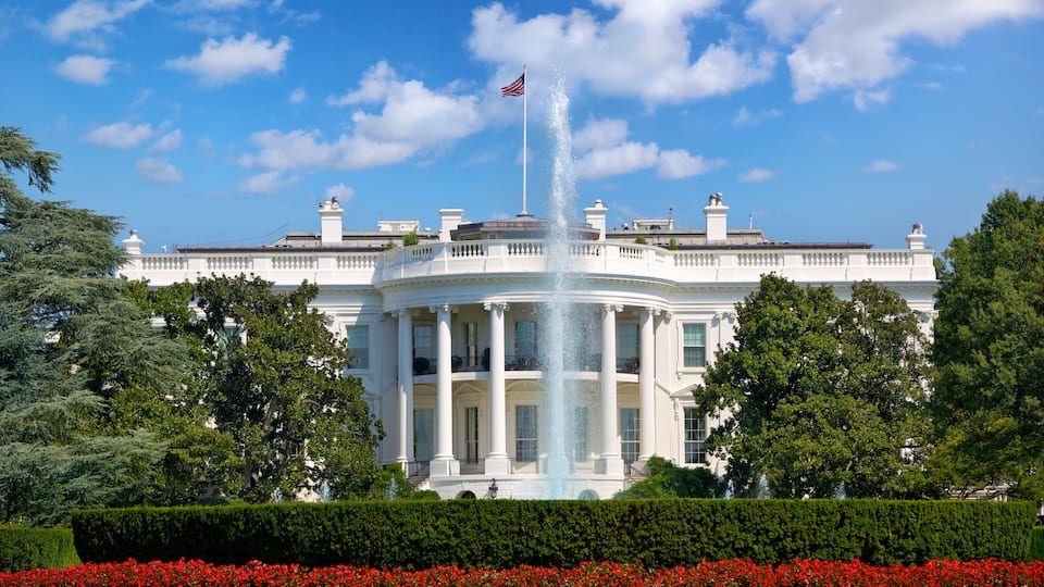 The White House with a fountain in front.