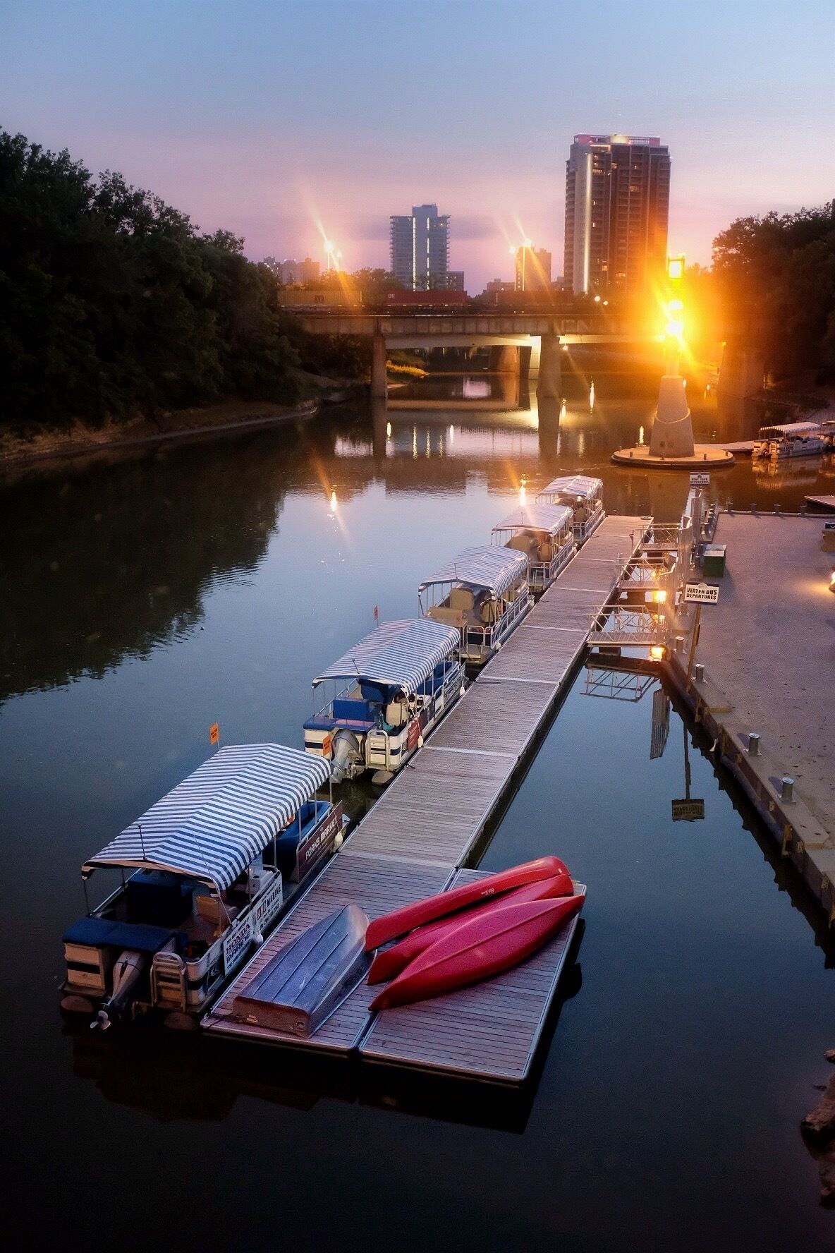Never be afraid to photograph at night. This was a hand held shot of the forks at the Assiniboine river. Taken from the bride overhead.