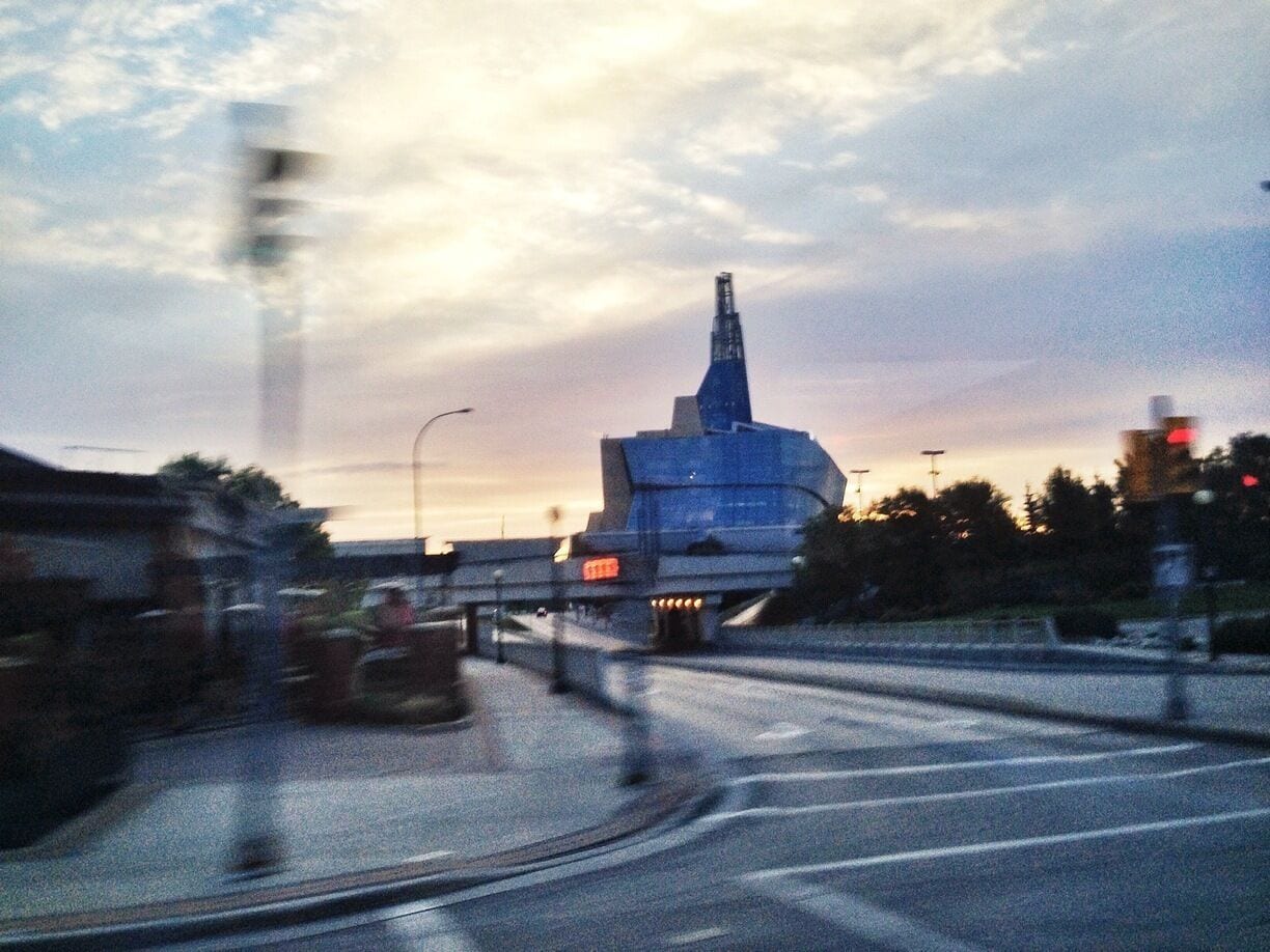 Seen this gigantic cool building upon entering the city if Winnipeg. This thing I mean is a gigantic swirling glass structure which was so cool to see considering I am in love with Architecture. 

Once I got to the airport I was able to google what this building is. 

According to Google it's the Canadian Museum for Human Rights. Sadly this is the only photo I got but I'd be interested in learning more. Too bad my layover isn't long enough for me to taxi over there to take a better look.
