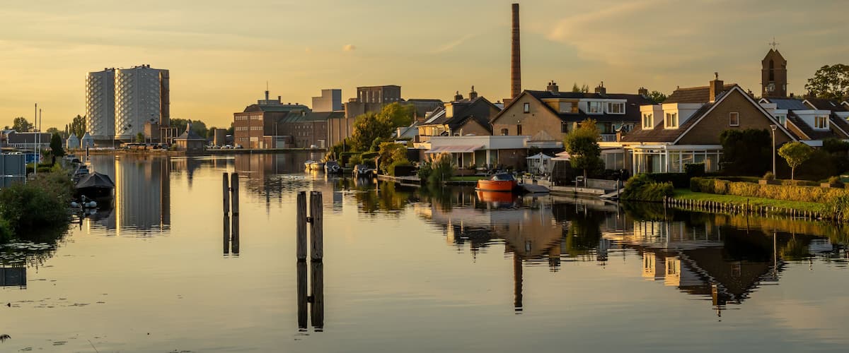 Dutch village of Halfweg seen from Zwanenburg with the ringvaart canal in the foreground