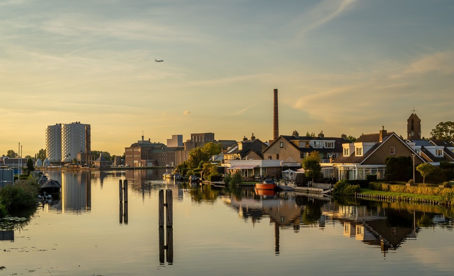 Dutch village of Halfweg seen from Zwanenburg with the ringvaart canal in the foreground