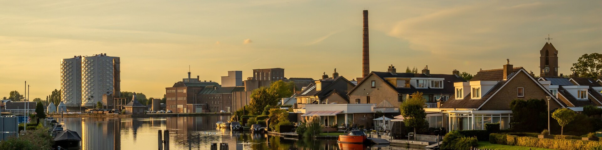Dutch village of Halfweg seen from Zwanenburg with the ringvaart canal in the foreground