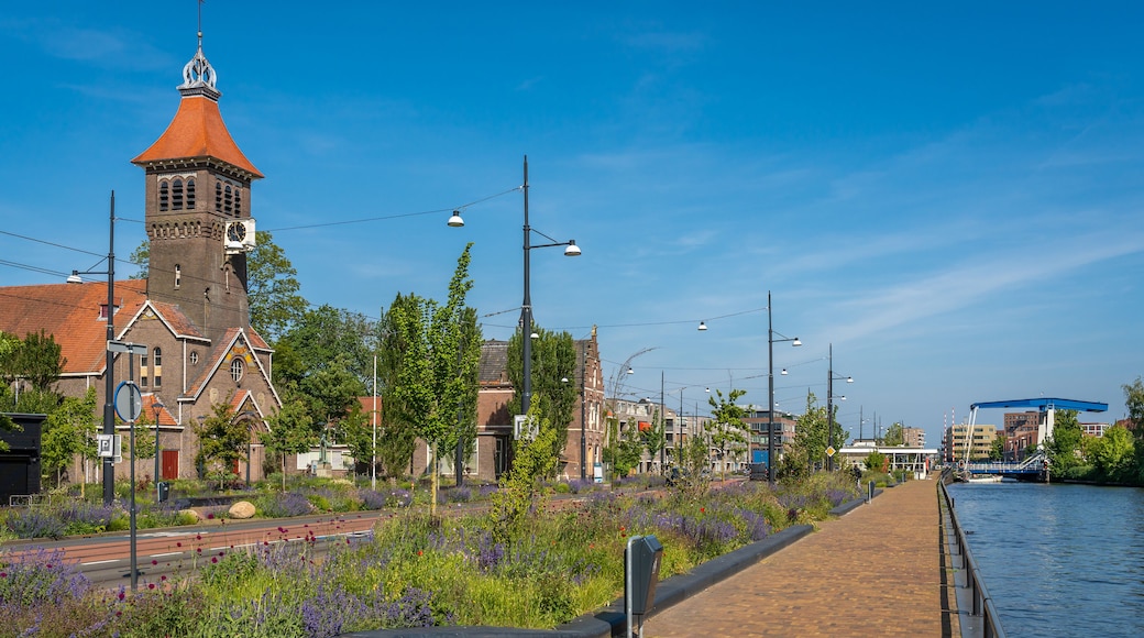Townscape of Diemen, southeast of Amsterdam, view of Weespertrekvaart canal and Sint Petrus Banden church