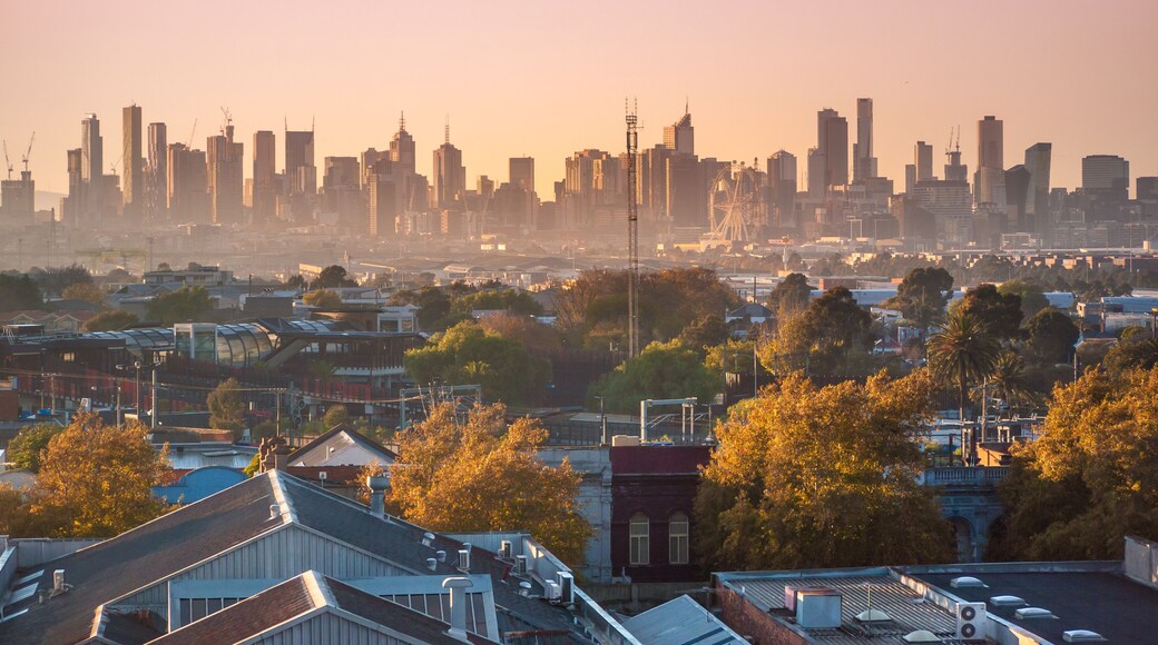 Skyscrapers in Melbourne's CBD in morning mist. Elevated view overlooking residential houses in western suburbs and modern buildings in city. Footscray, VIC Australia.
