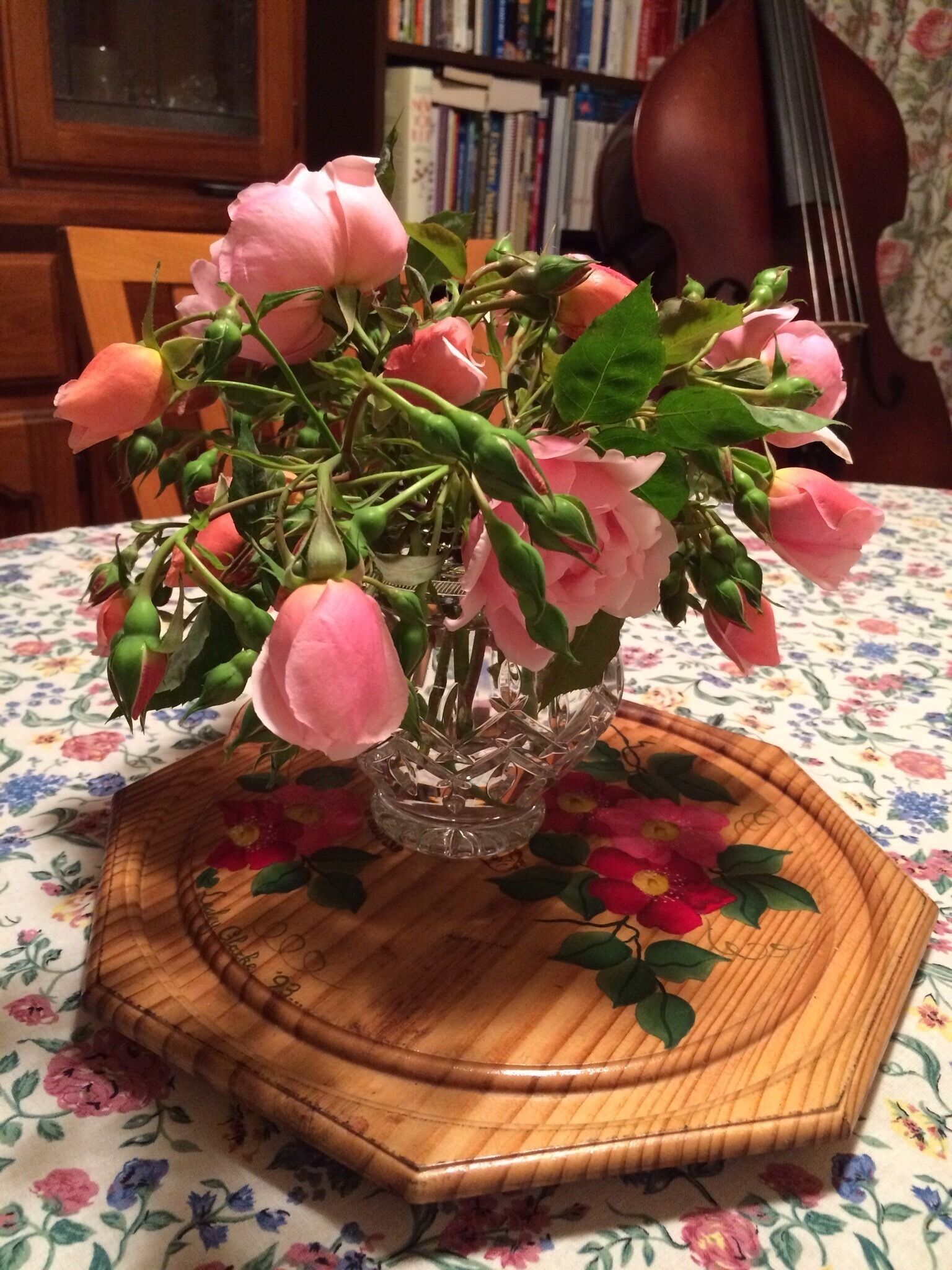 Rosa 'Albertine' in crystal bud vase from my Spring garden in Glen Waverley. 
A fragrant rambling climber that grows abundantly on my sunny back house wall.  My Mum suggested yesterday that I pick some!  I don't usually pick them because of their seeming fragility and thorniness.  
Alas, here is my display of Rosa 'Albertine' sweetly fragrant on my dining room table.