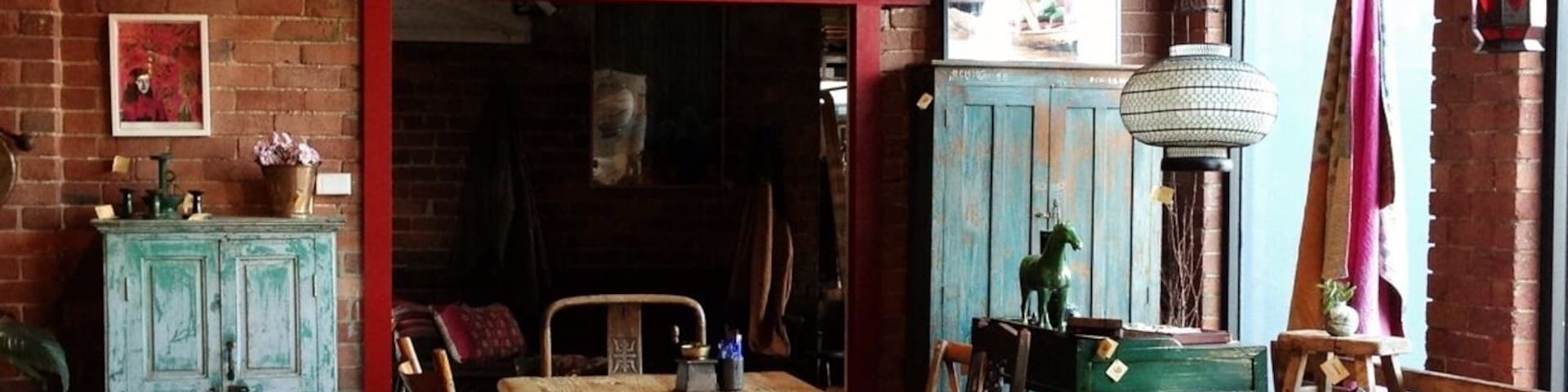 You wouldn't know from the outside but the inside is a spectacular space. What better way to sell antiques than to display it while you sit and drink your coffee?