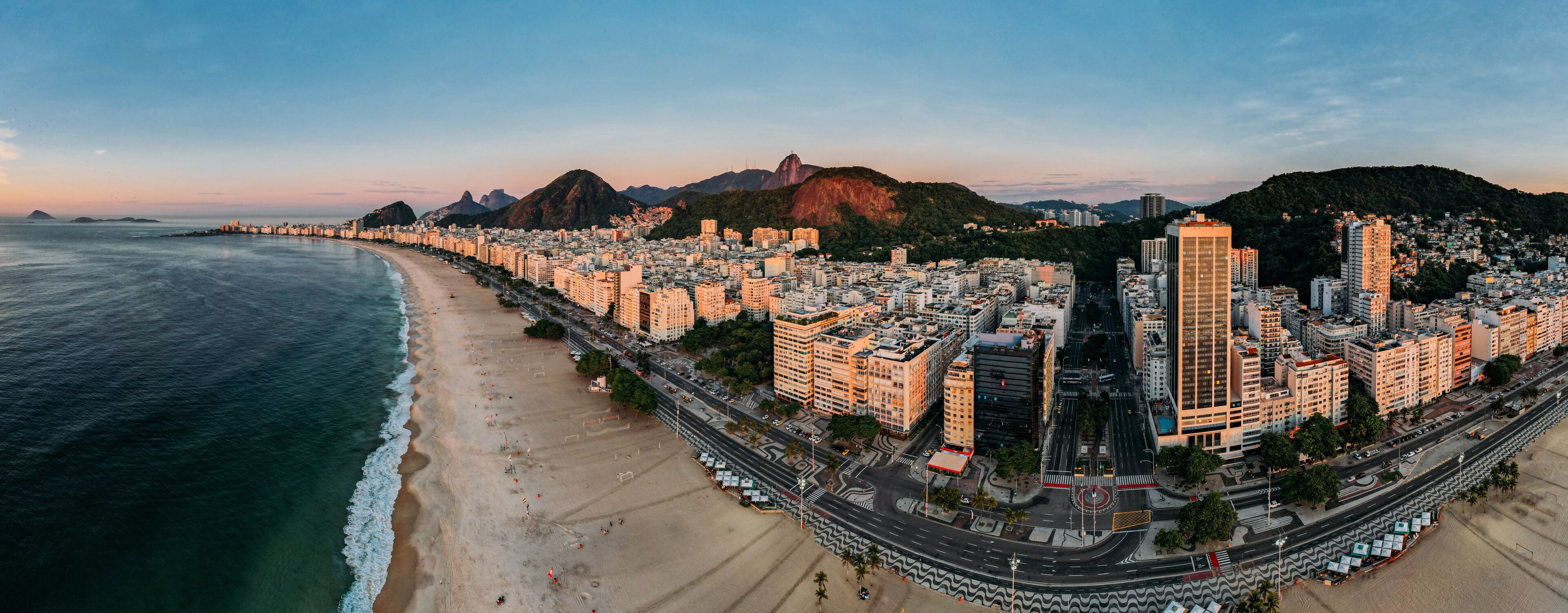 Aerial drone view of Copacabana Beach and urban setting at sunrise, UNESCO World Heritage Site, Rio de Janeiro, Brazil