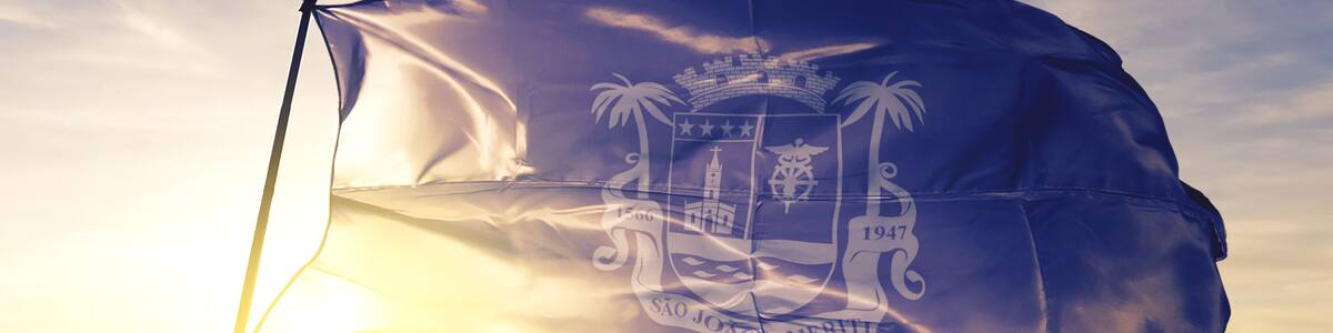 Sao Joao de Meriti of Brazil flag waving on the top sunrise mist fog