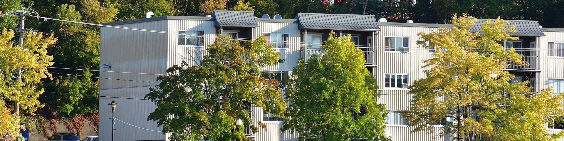 Sherbrooke Ste-Therese church cityscape with Nation lake in the foreground during early fall