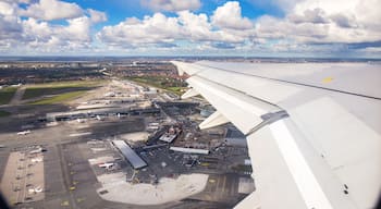 Aerial view of Copenhagen airport or Kastrup airport from window seat of airplane takeoff over Copenhagen Airport for passenger transportation in Denmark to another location in Europe
