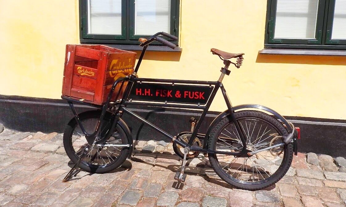 Dragor, Denmark, where the old part of town is a compact, picturesque maze of alleys with yellow-painted houses, red roofs, and cobblestone streets built in the traditional Danish style. 

#bicycle #Dragor #Danish #OnTheRoad