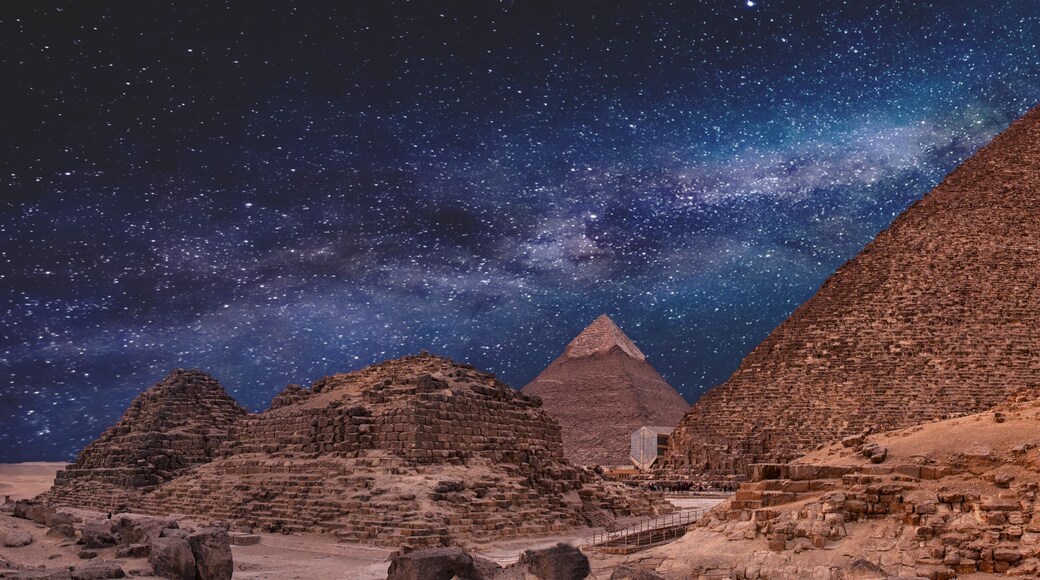 Night sky of the Milky Way over the great pyramids on the plateau of Giza, Egypt, Africa.