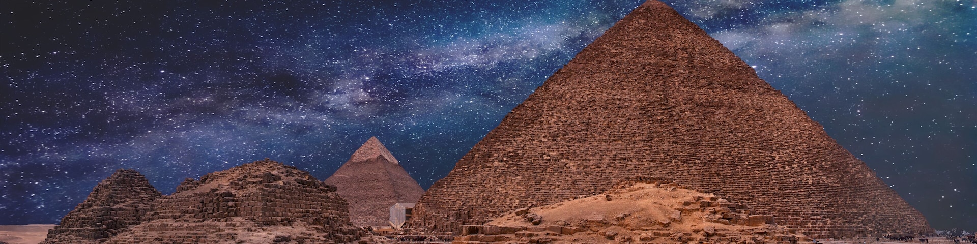 Night sky of the Milky Way over the great pyramids on the plateau of Giza, Egypt, Africa.