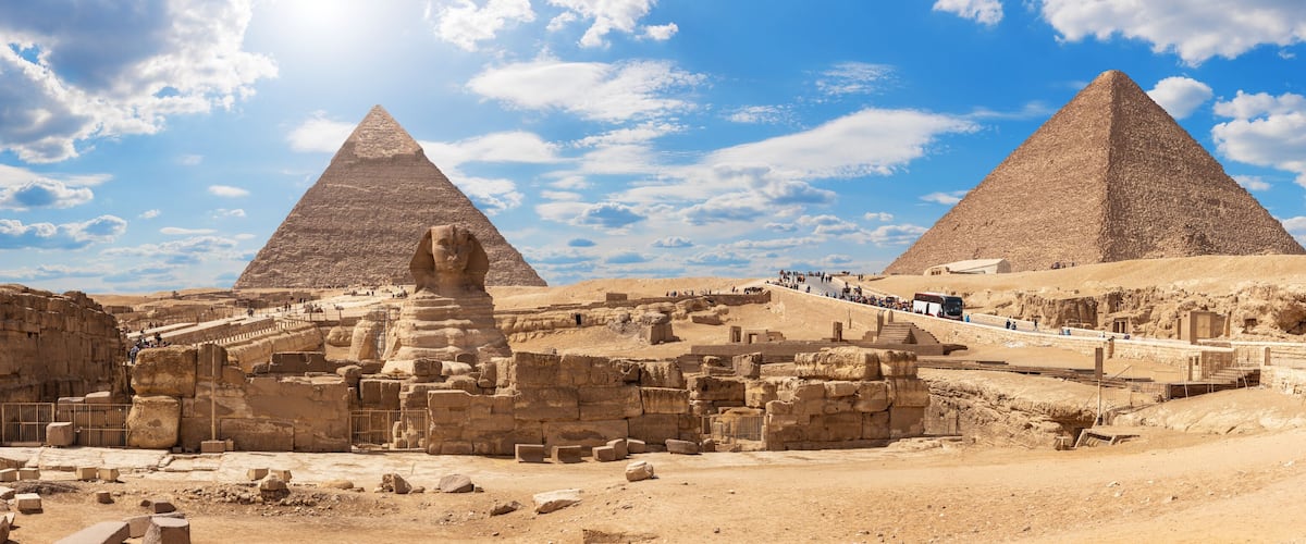 The Great Pyramid of Giza, the Sphinx, and ancient ruins.