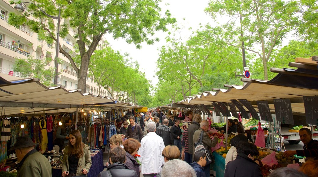 Montparnasse featuring markets as well as a large group of people