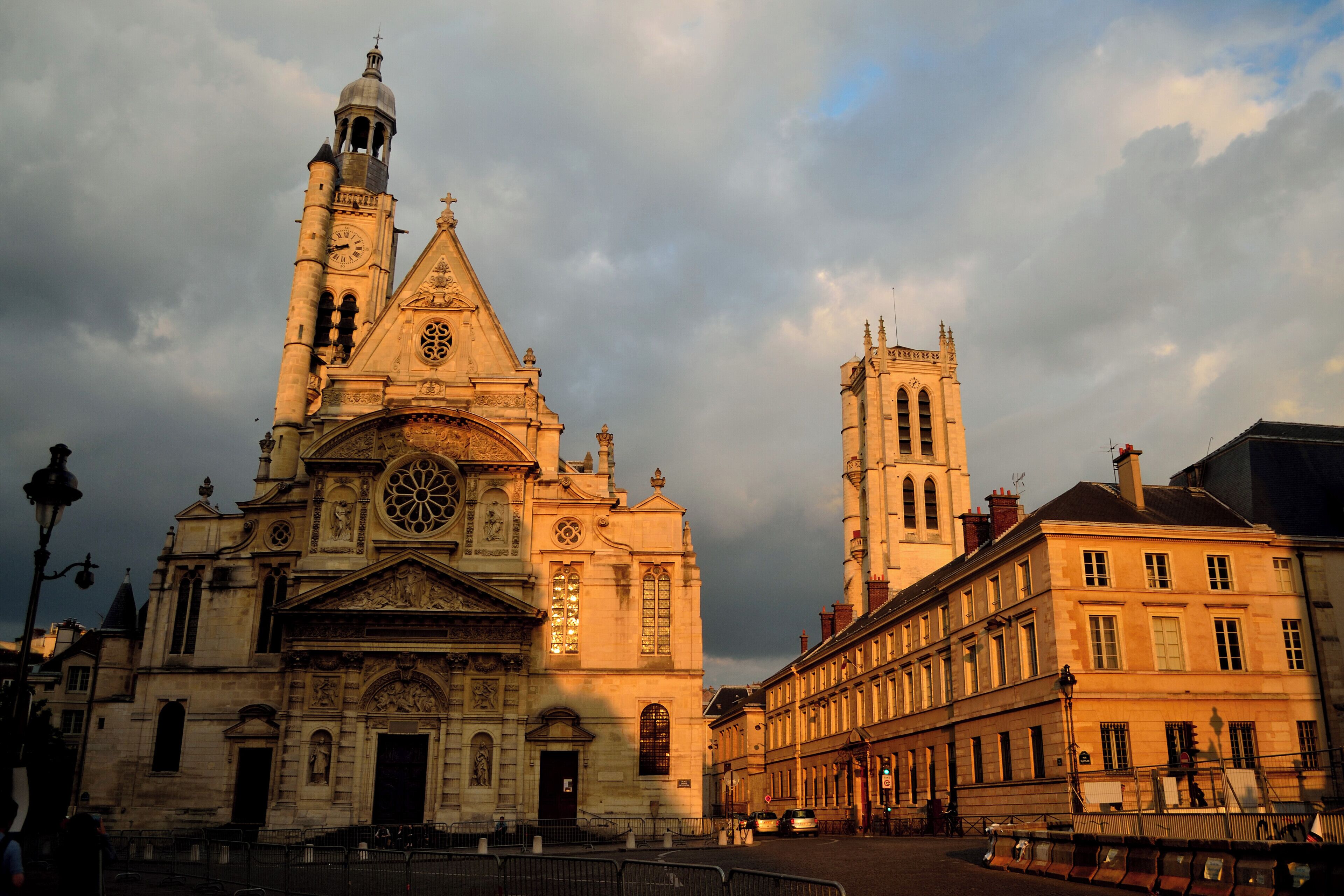 A historic cathedral with a prominent bell tower and a large rose window.