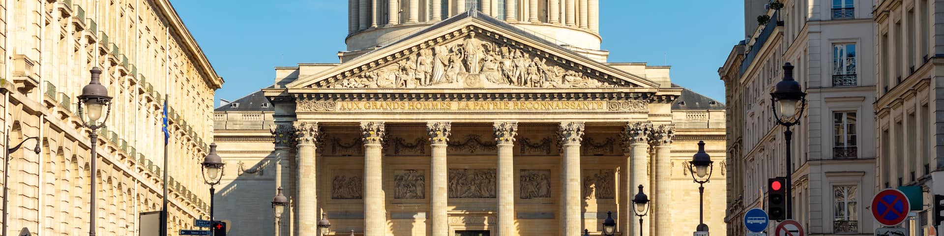A grand neoclassical building with a large dome and columns.