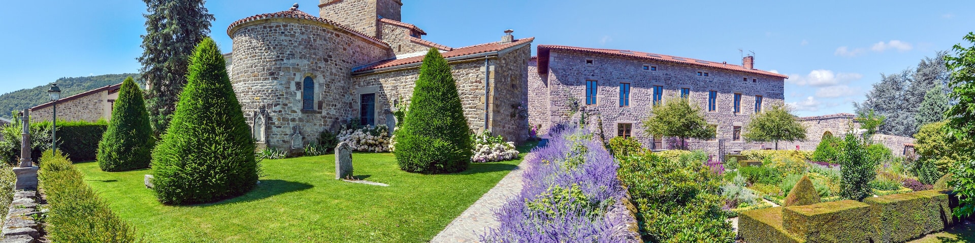 Panoramic view of Saint Victor church at left and the part of the castle from the garden. Saint Etienne metropole.