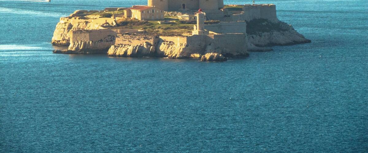 A coastal fortress on a small island surrounded by water.