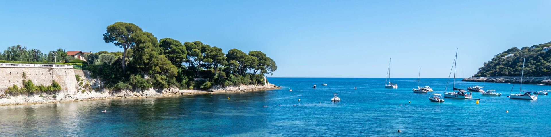 Aerial view of the beautiful Fosses Beach in Saint Jean Cap Ferrat with tropical colored water
