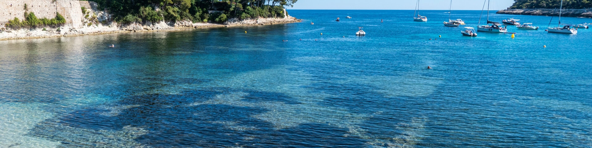 Aerial view of the beautiful Fosses Beach in Saint Jean Cap Ferrat with tropical colored water