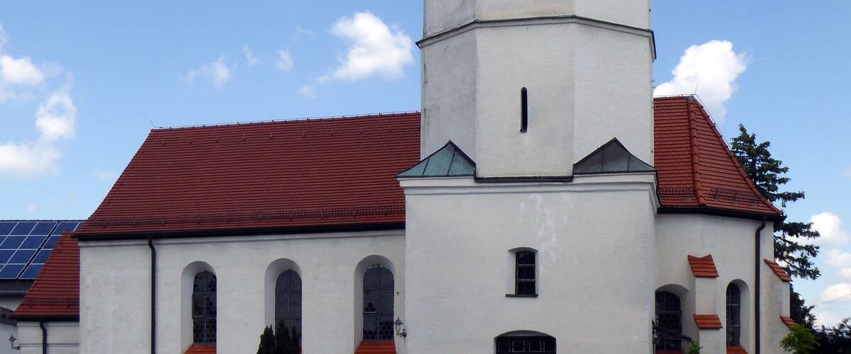 A church with a tall bell tower and a dome.