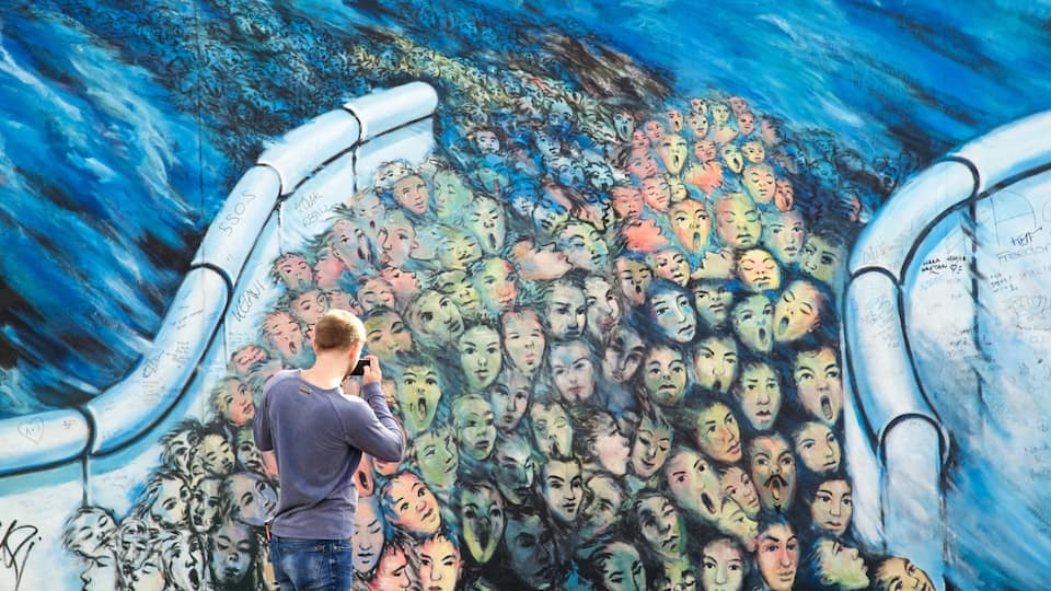 Friedrichshain showing outdoor art as well as an individual male