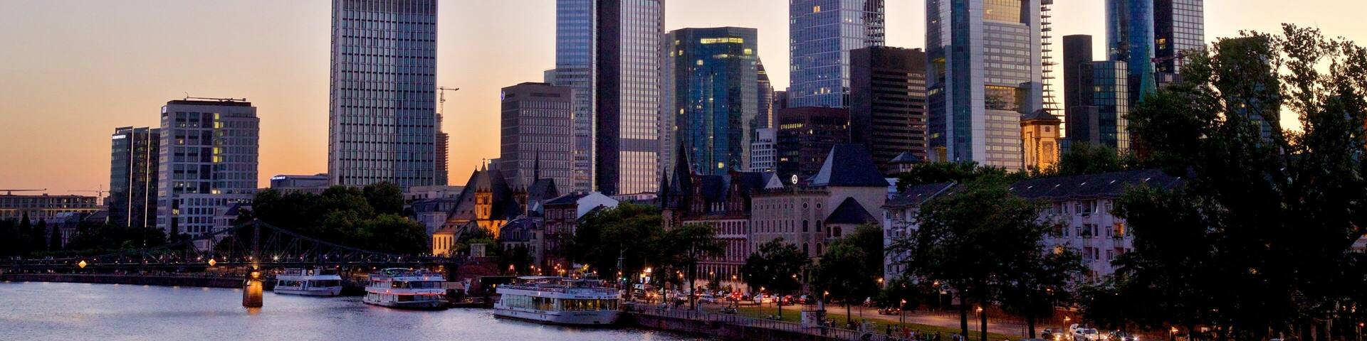 Niederrad featuring a city, a river or creek and a sunset