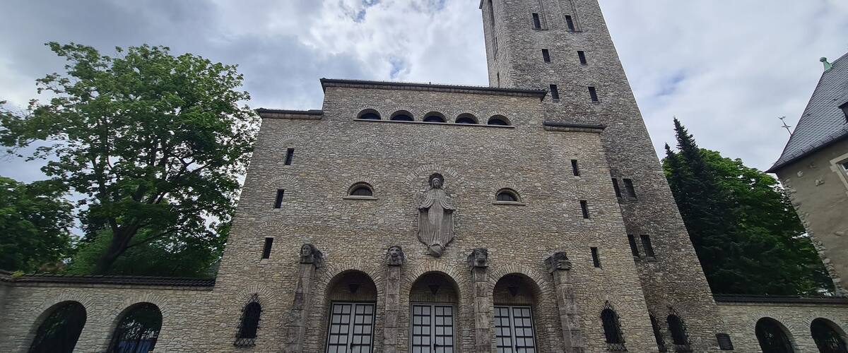 catholic church with atmospheric sky in Berlin Karlshorst