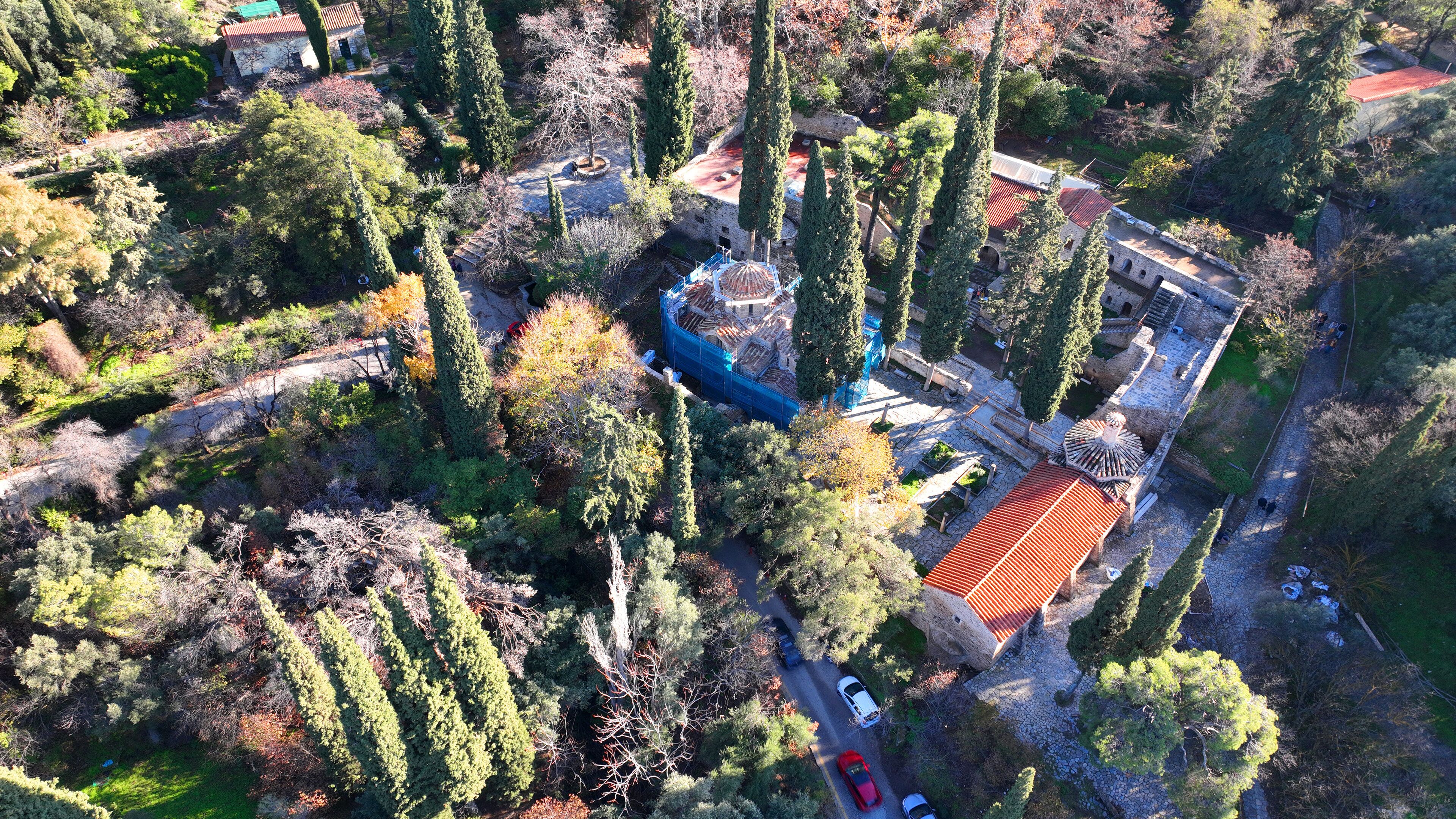 Aerial drone photo of famous Byzantine monastery of Kesariani in the slopes of Hymettus mountain, Attica, Greece