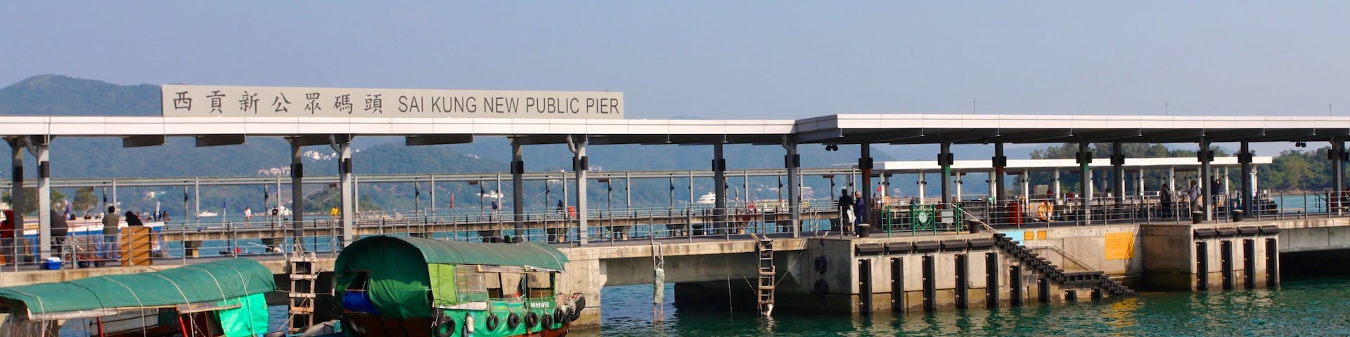 Sai Kung which includes a bay or harbor, general coastal views and signage