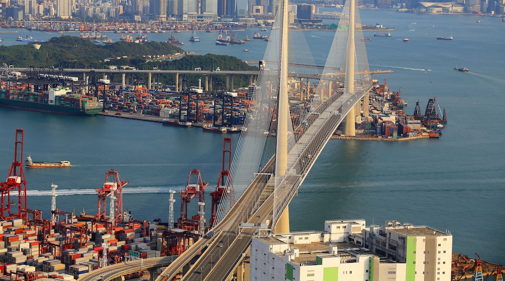 Kwai Tsing container terminal port view in drone, and hong kong skyline and stonecutter's bridge