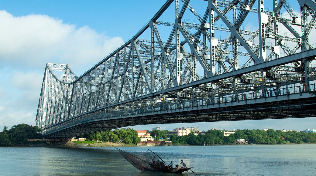 iconic Howrah bridge or Rabindra Setu of Kolkata and boat in river Ganges