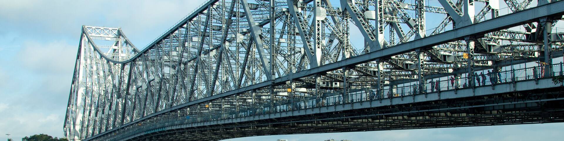 iconic Howrah bridge or Rabindra Setu of Kolkata and boat in river Ganges