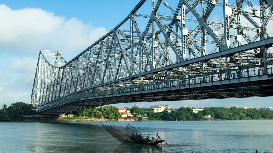 iconic Howrah bridge or Rabindra Setu of Kolkata and boat in river Ganges